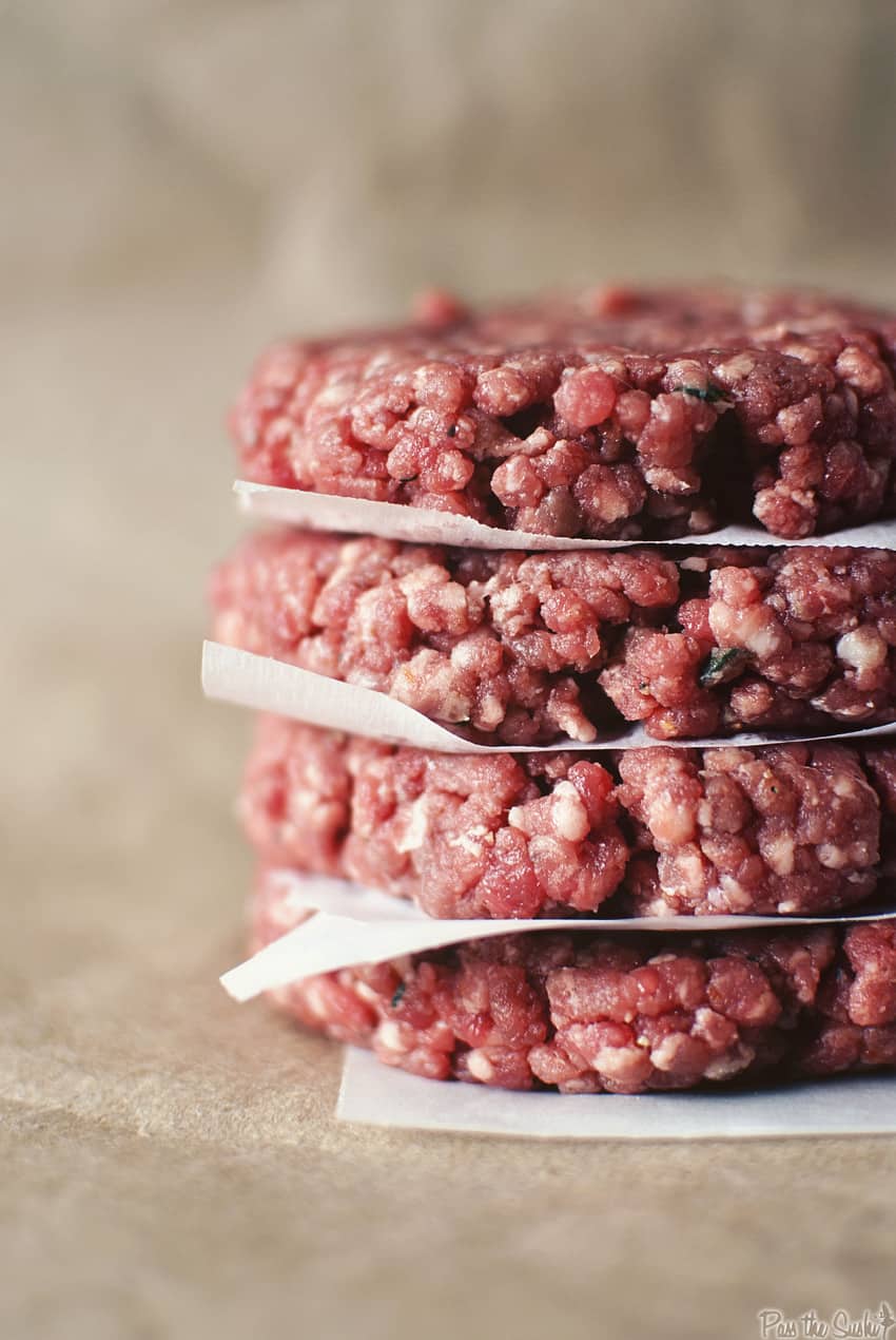 Ground beef patties stacked up.