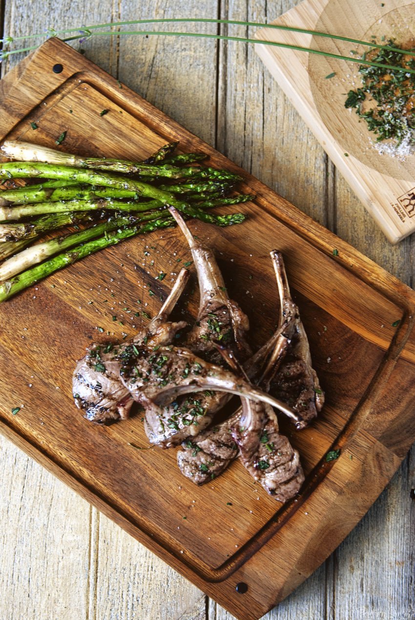 Grilled Lamb Chops just straining off their bones. A gorgeous pile of sautéed asparagus, sea salt and lavender.