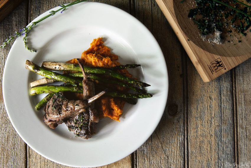 Lamb Chops plated with asparagus and squash. 