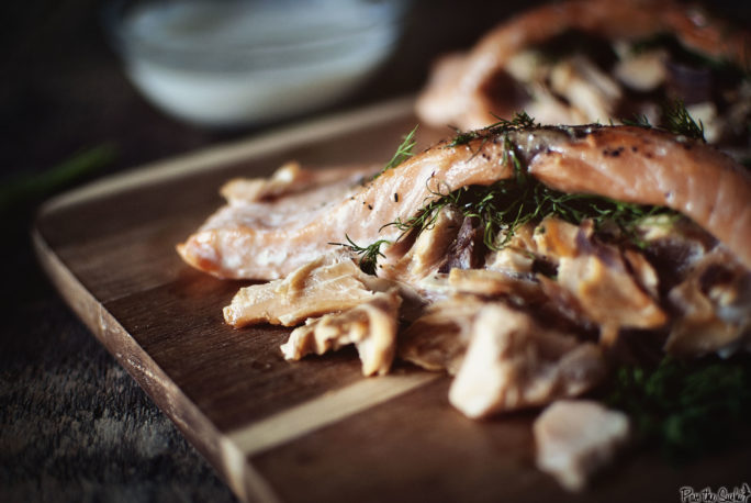 Double-Smoked Stuffed Salmon on a cutting board