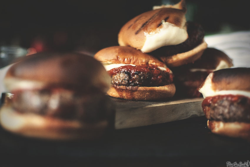 I count 5 Pepperoni Sliders in this photo, with mozzarella and marinara pouring out of them. The question is, where are yours?