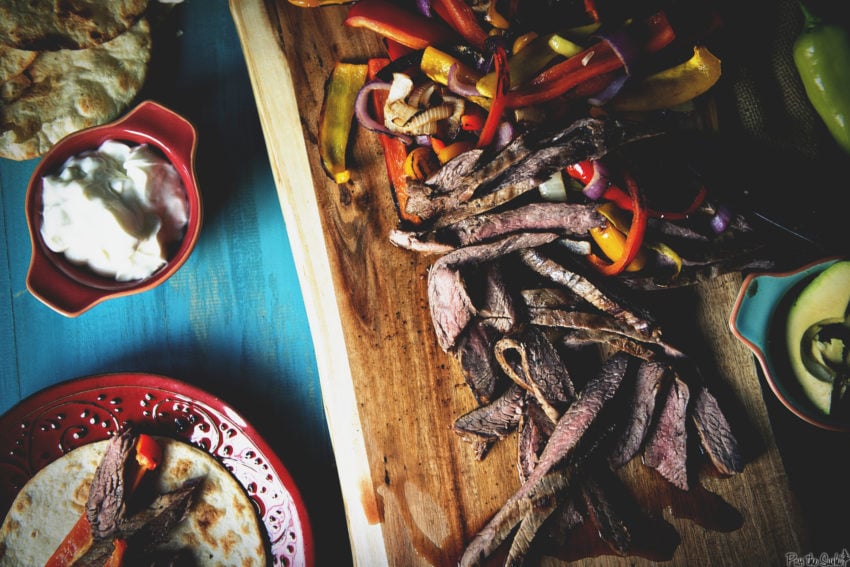 Just looking at these strips of tender beef is making me hungry! laid out with peppers, onions, avocado and sour cream, they are ready to fill your fajita!