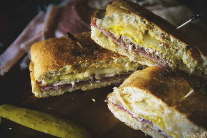 These Grilled Cuban Sandwiches are ready to serve! Packed with pork, ham, salami and spicy mustard. Save me one!