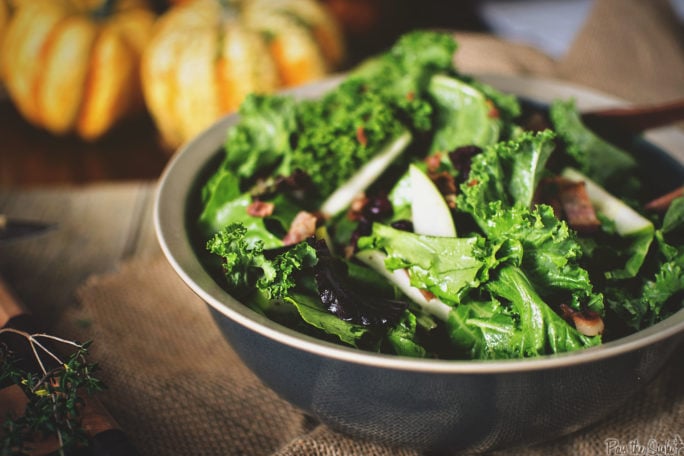 Kale & Apple Salad loaded with bits of Warm Bacon. This is a carnivore's salad.