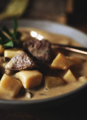 Big bites of beef in a creamy bowl of potato soup