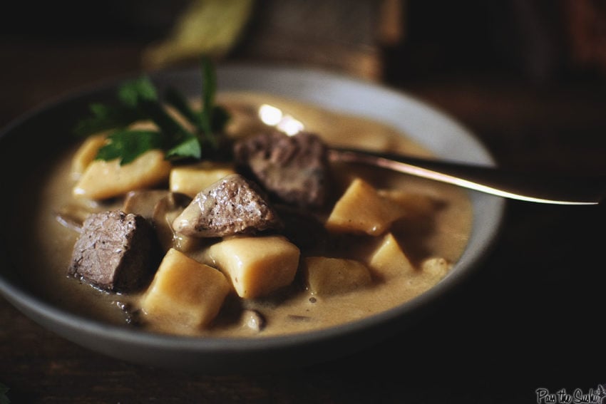 Big bites of beef in a creamy bowl of potato soup