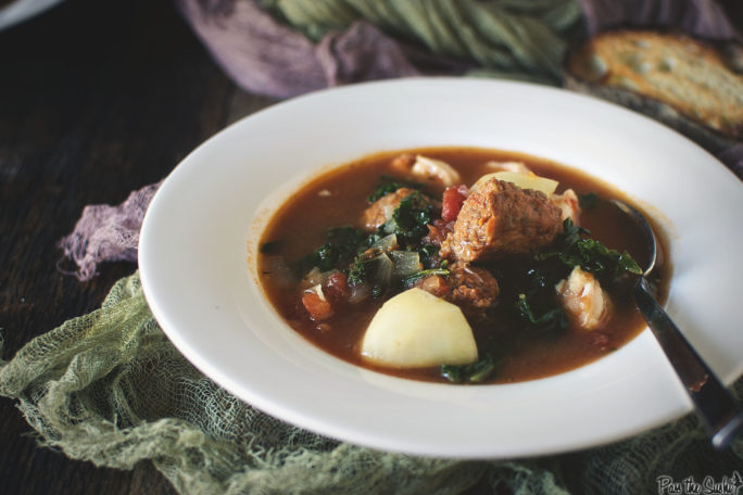 There is a giant chunk of  Chorizo peeking out of this Stew. Grab a spoon and a spot by the fire.