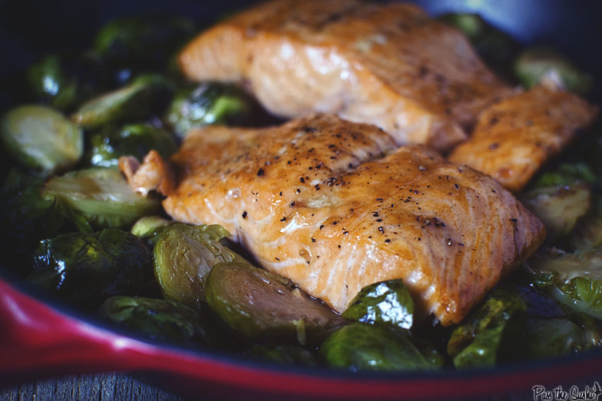 Plump Salmon filets just browed with maple syrup perched atop seared Brussels sprouts. This is what makes dinner magic!