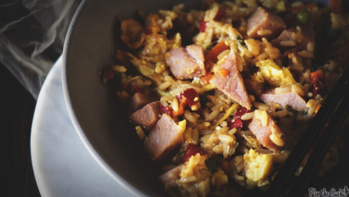 Chunks of ham, eggs and pepper layered over some perfect fried rice. This is how to use leftovers!