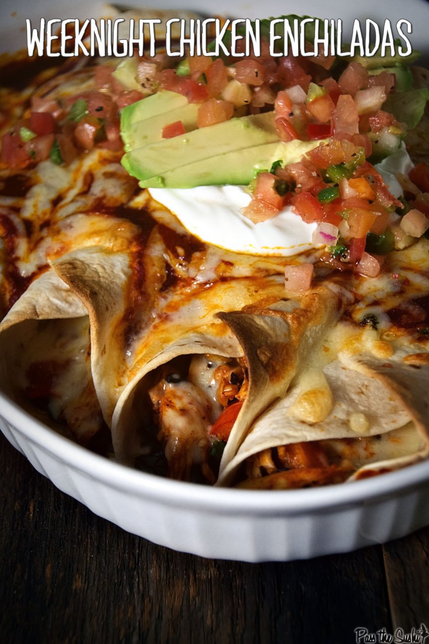 enchiladas with pico de gallo, sour cream and sliced avocado in a white dish pin