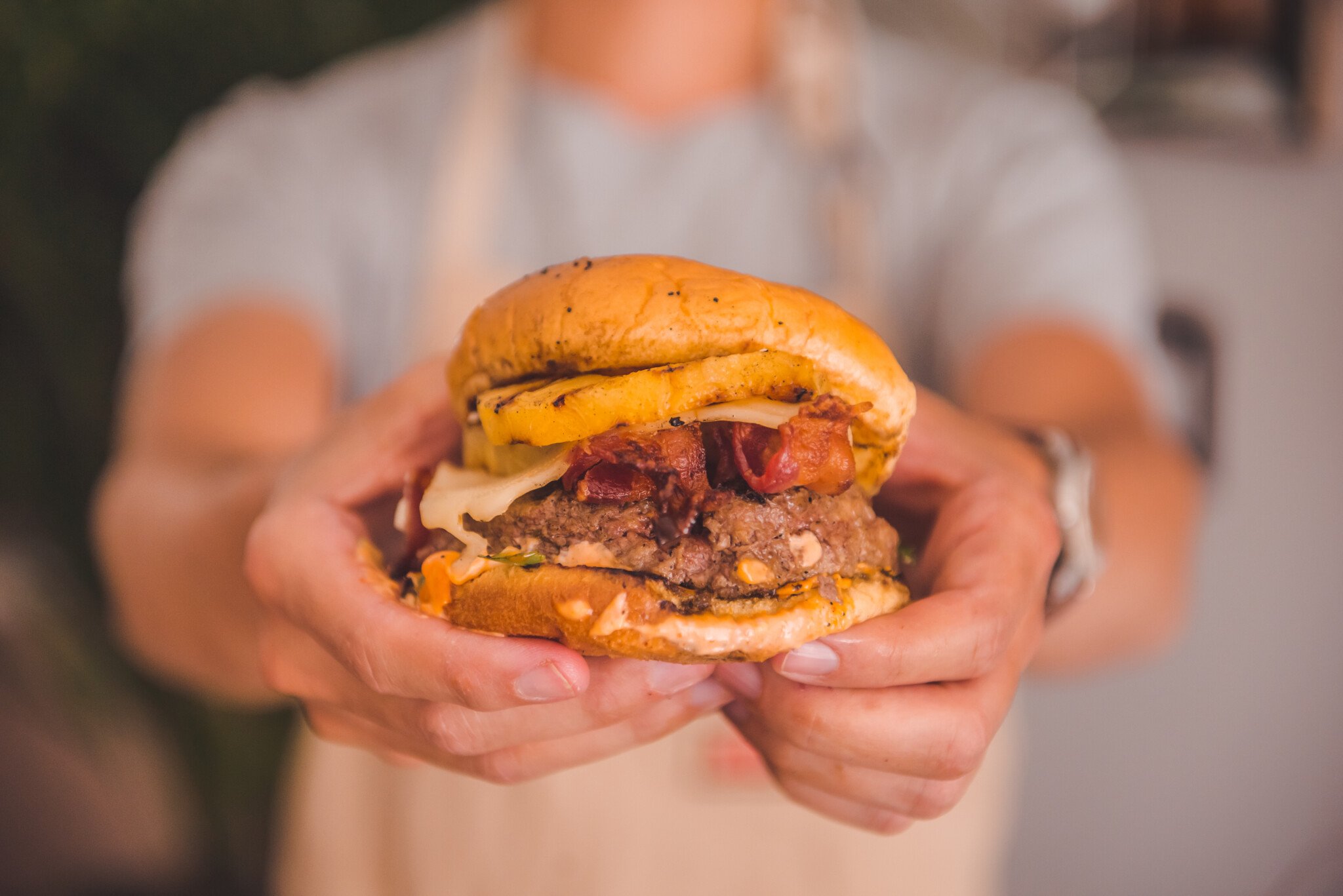 man holding burger