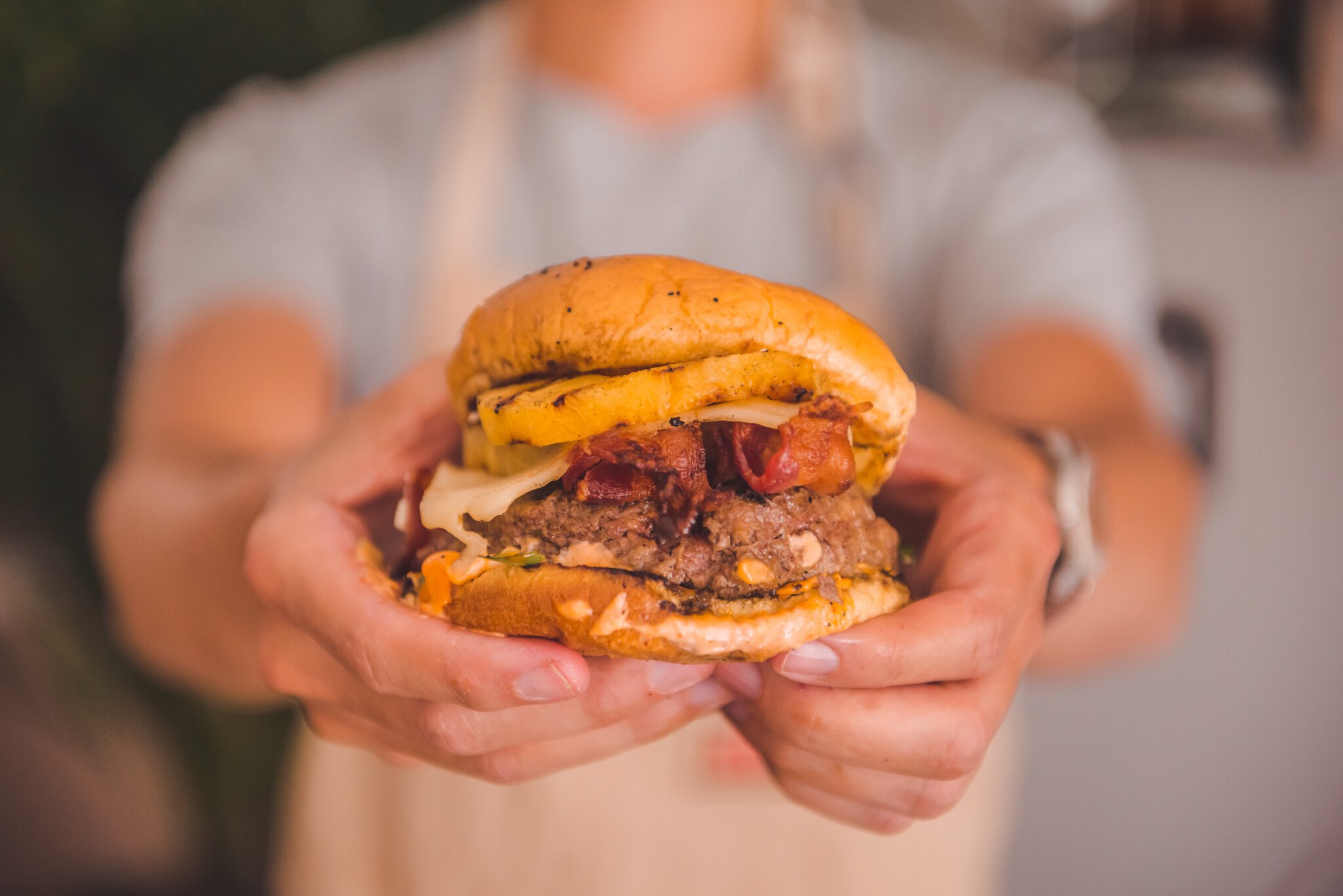 Man holding burger.