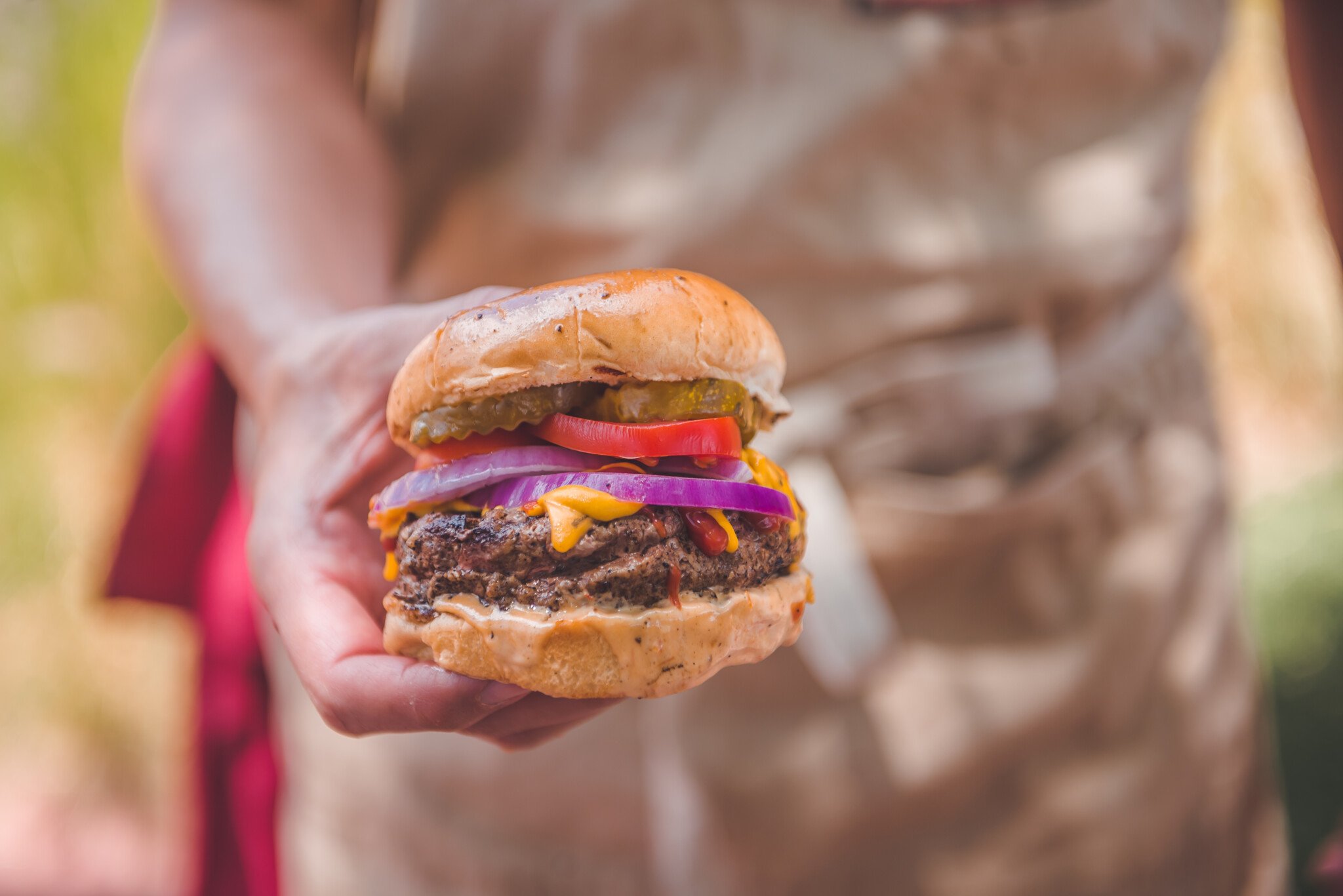 Man holding burger.