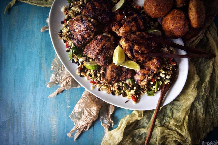 Grilled Chicken Thighs over succotash on a platter. All rubbed down in Ancho, so good!