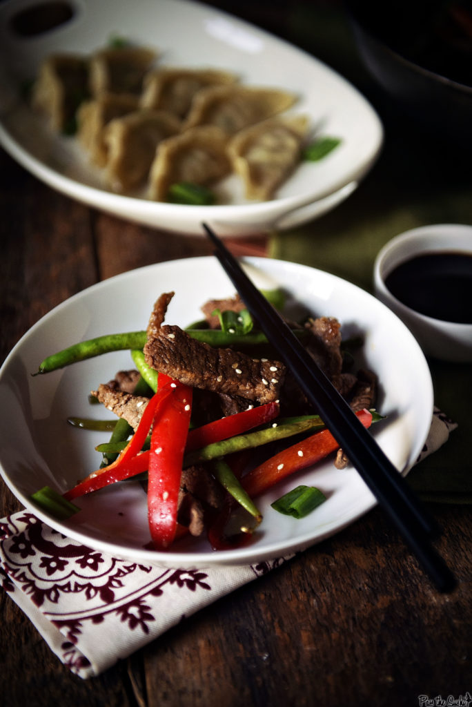 Just look at the sesame seeds sprinkled over the steak and veggies! Absolutely perfect. And those pot stickers in the background, you should look that recipe up too.