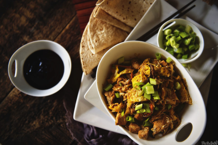 Moo Shu Pork with scallions on the side and toasted wraps.