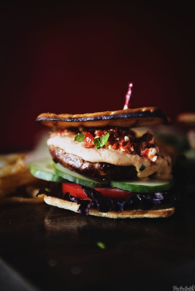 This is a veritable stack of flavor! From the top; roasted red peppers, hummus, lamb patty, cucumbers, tomato and red leaf lettuce. All on a flatbread. You're gonna like the way this tastes.