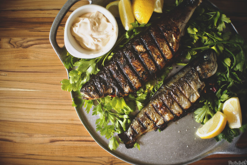 Rainbow trout stuffed with herbs grilled with crisped skin.