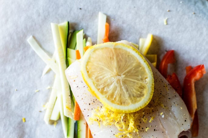 Halibut Baked in Parchment with Pistachio Mint Pesto Recipe | Kita Roberts GirlCarnivore.com