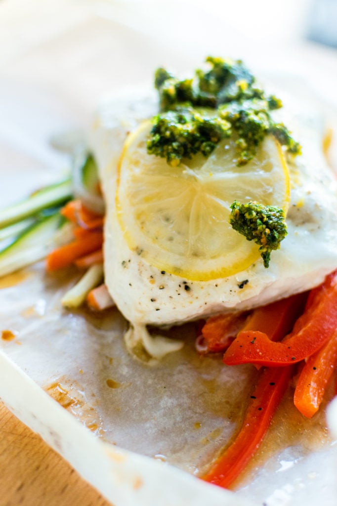 Halibut Baked in Parchment with Pistachio Mint Pesto Recipe | Kita Roberts GirlCarnivore.com