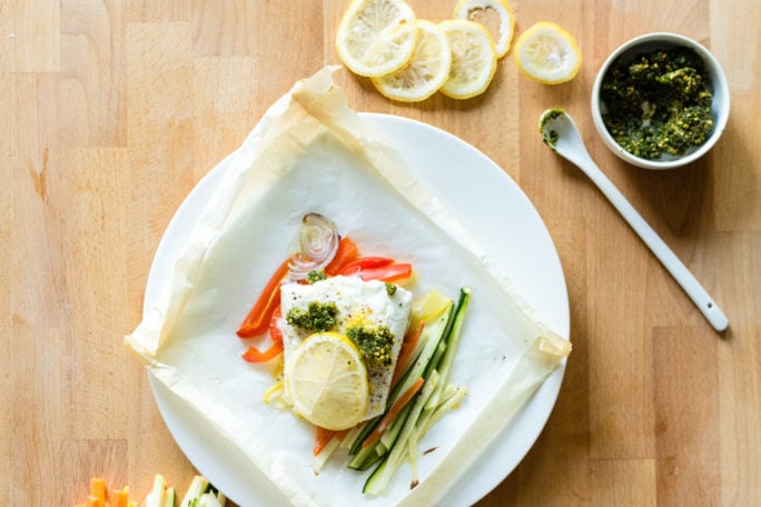 Halibut Baked in Parchment with Pistachio Mint Pesto Recipe | Kita Roberts GirlCarnivore.com