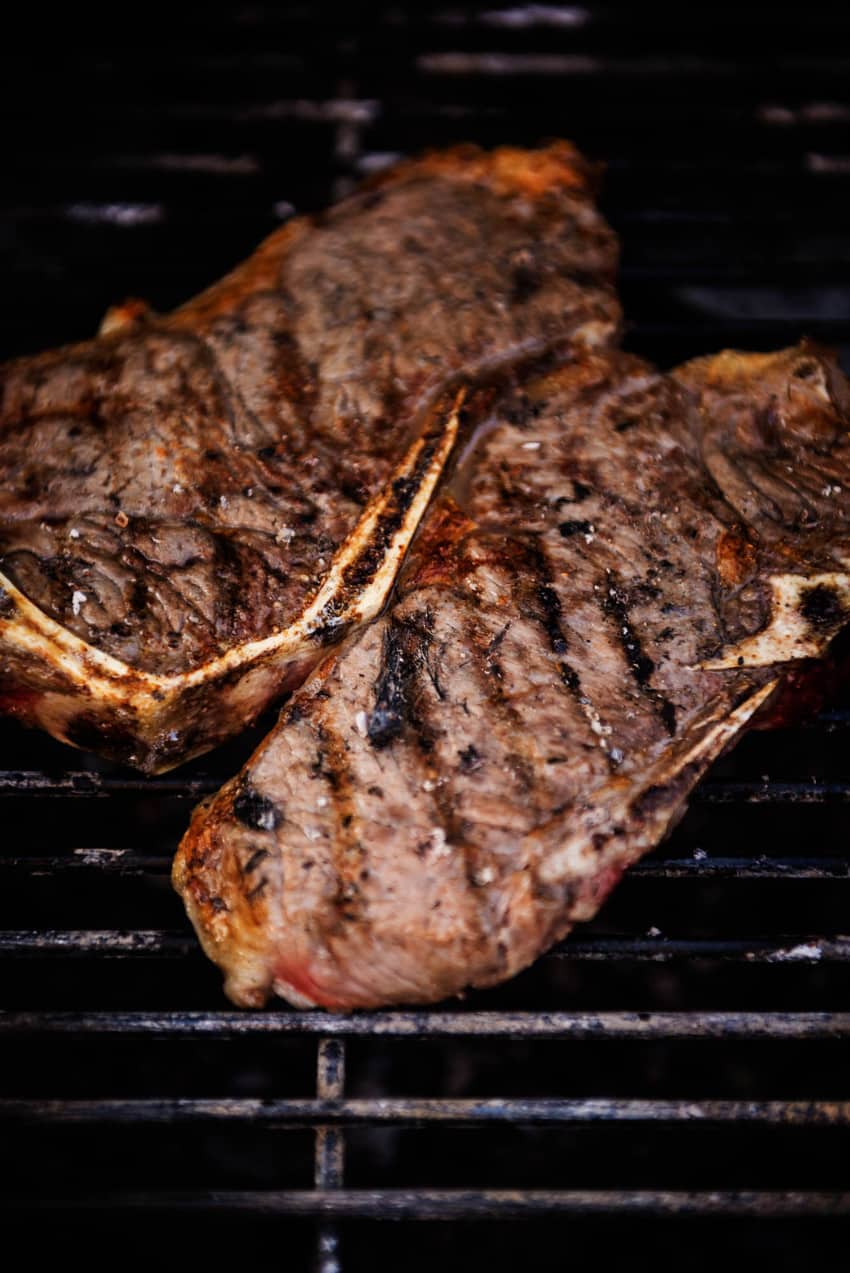 New York Strip steaks grilling on Char-Broil grill