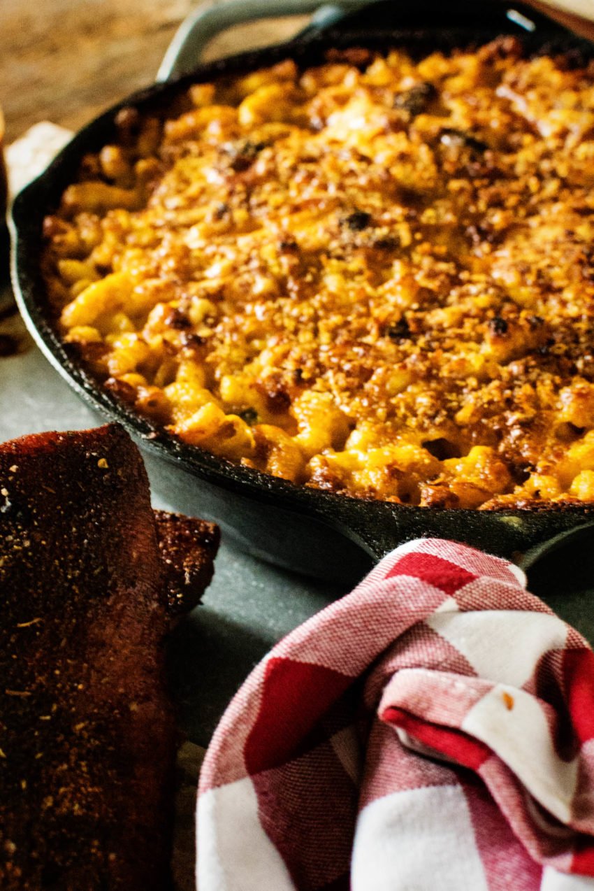 Cast iron skillet loaded with smoke macaroni and cheese.