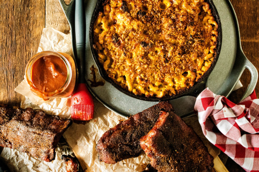 Huge spread of cast iron mac and cheese and smoked ribs.