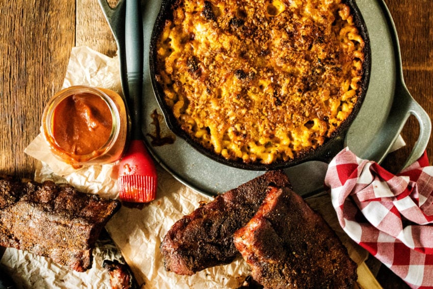 Huge spread of cast iron mac and cheese and smoked ribs.