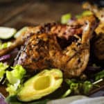 SMOKED LEG QUARTERS WITH GRILLED AVOCADO, SCALLION, AND RED ONION