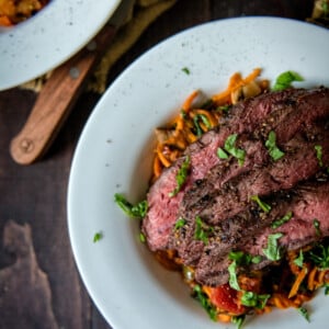 Whole 30 Grilled Flat Iron Steak Over Marinara Tossed Sweet Potato Noodles | Kita Roberts GirlCarnivore.com