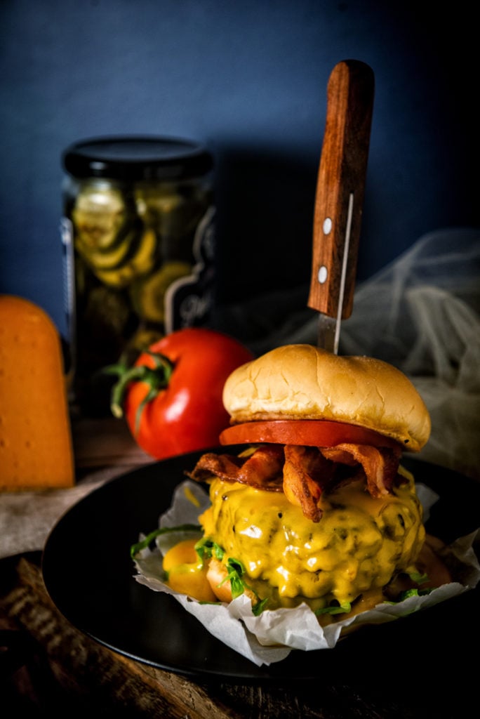 A giant hunk of beef, slathered in cheese, bacon, tomato on a toasted bun. So big I had to skewer it together with a steak knife.