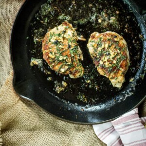 Two chicken patties cooked in a skillet