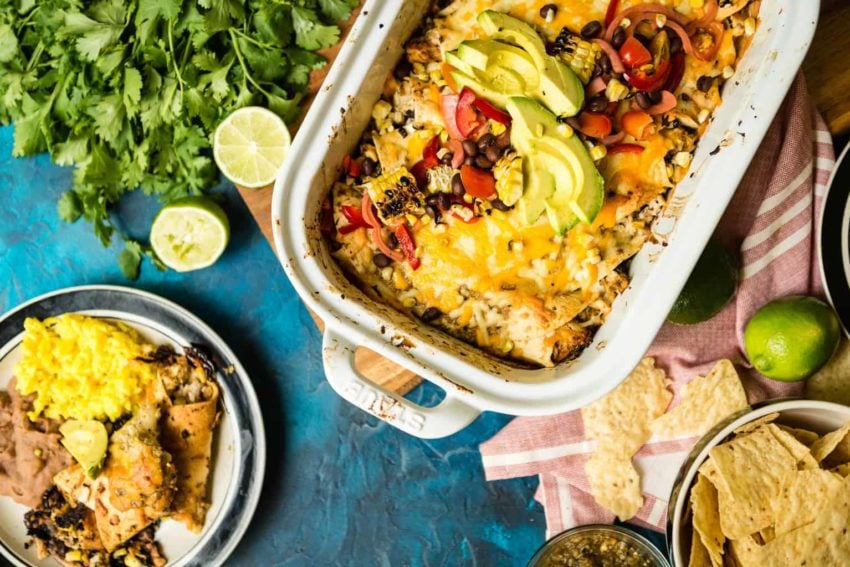 Fresh sliced avocado, peppers, tomatoes and cheese coat this platter of enchiladas. Inside, smoked Alaskan Halibut. yeah. this is good.