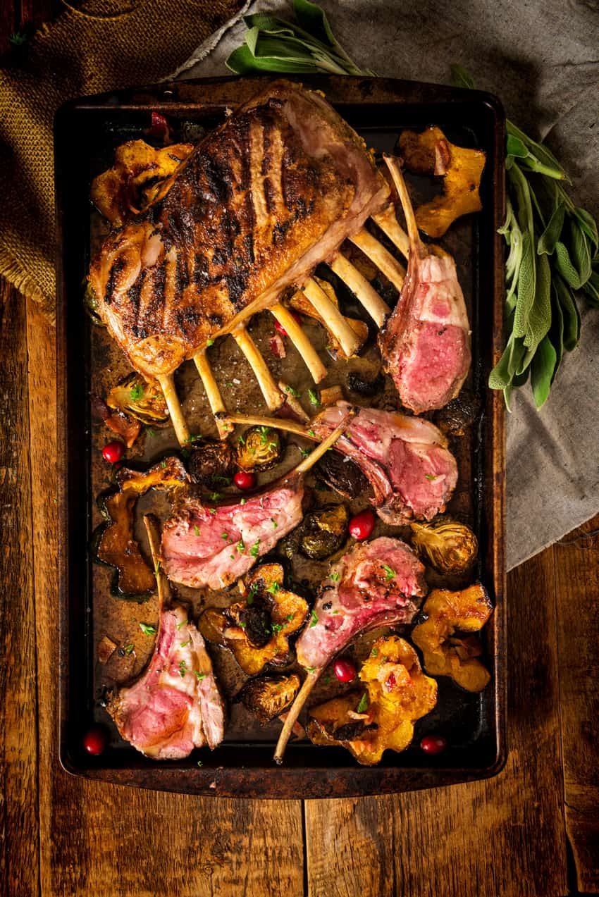 Perfect Grilled Rack of Lamb on rustic table.