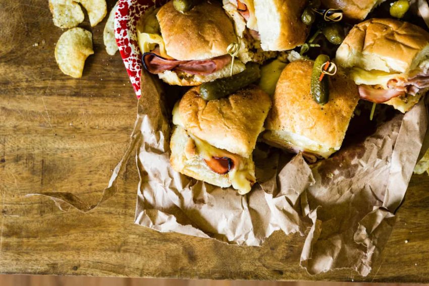 Overhead shot of ham and cheese slides stacked in a platter.