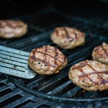 Lamb burgers on a grill.