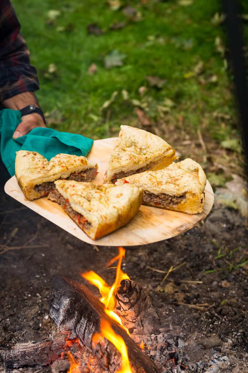 Infuse global flavor into your next pizza with this campfire Berber pizza, Aka, Moroccan Lamb Pizza. A fun stuffed bread baked over a classic campfire.