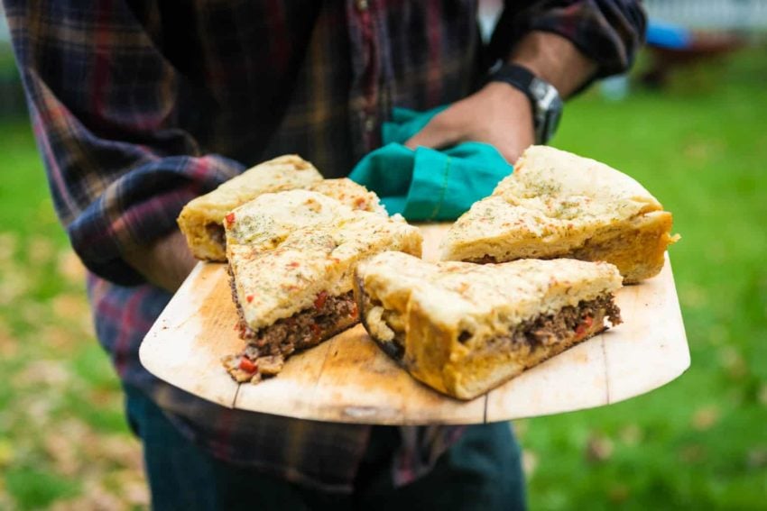 Infuse global flavor into your next pizza with this campfire Berber pizza, Aka, Moroccan Lamb Pizza. A fun stuffed bread baked over a classic campfire.