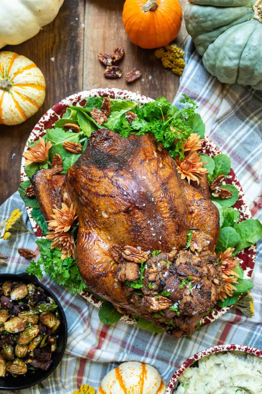 Whole Smoked Turkey with Candied Pecan and Apple Stuffing is ready to be served