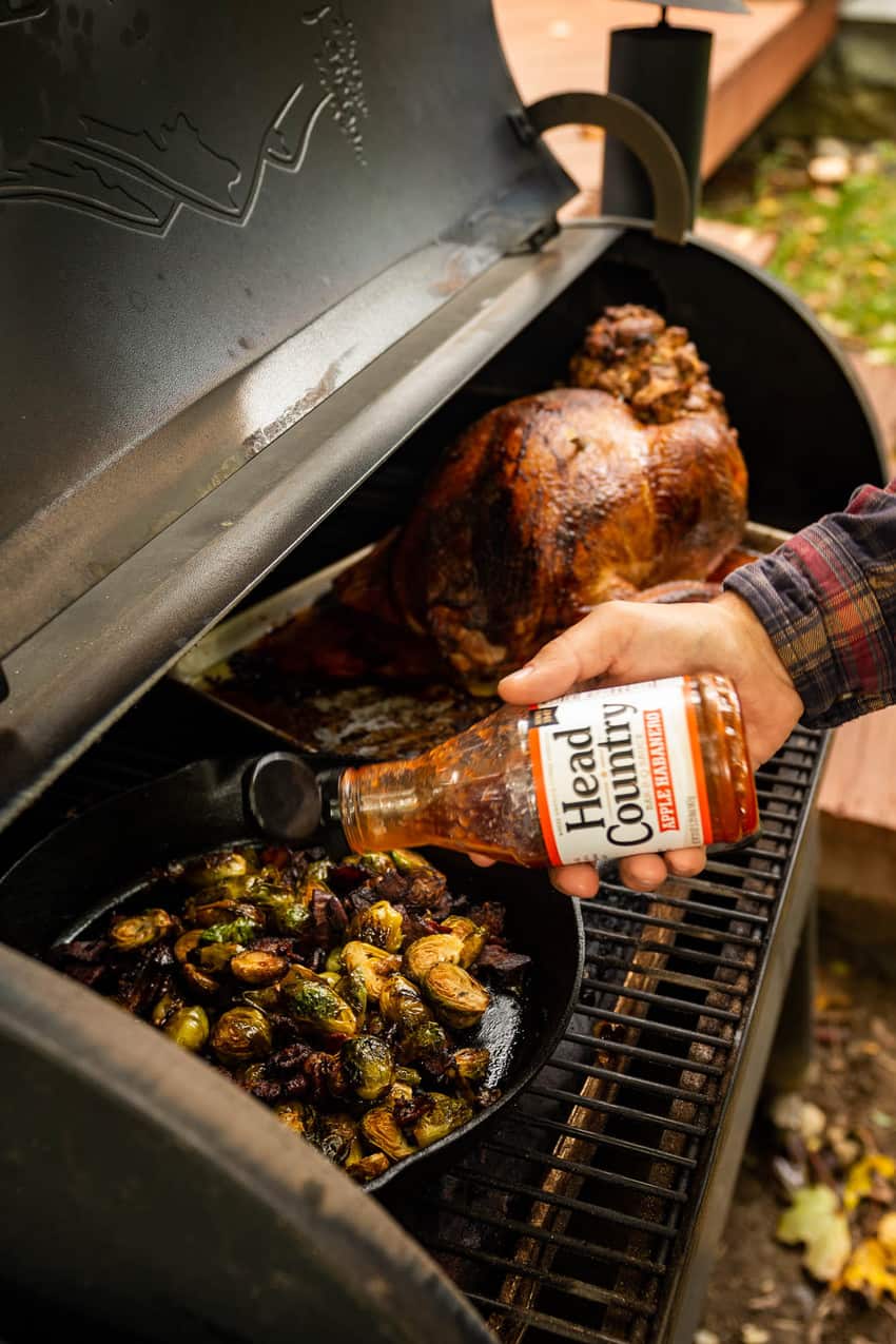 Kita Roberts cooking the BBQ Glazed Smoked Brussels Sprouts with Bacon using Head Country Apple Habanero