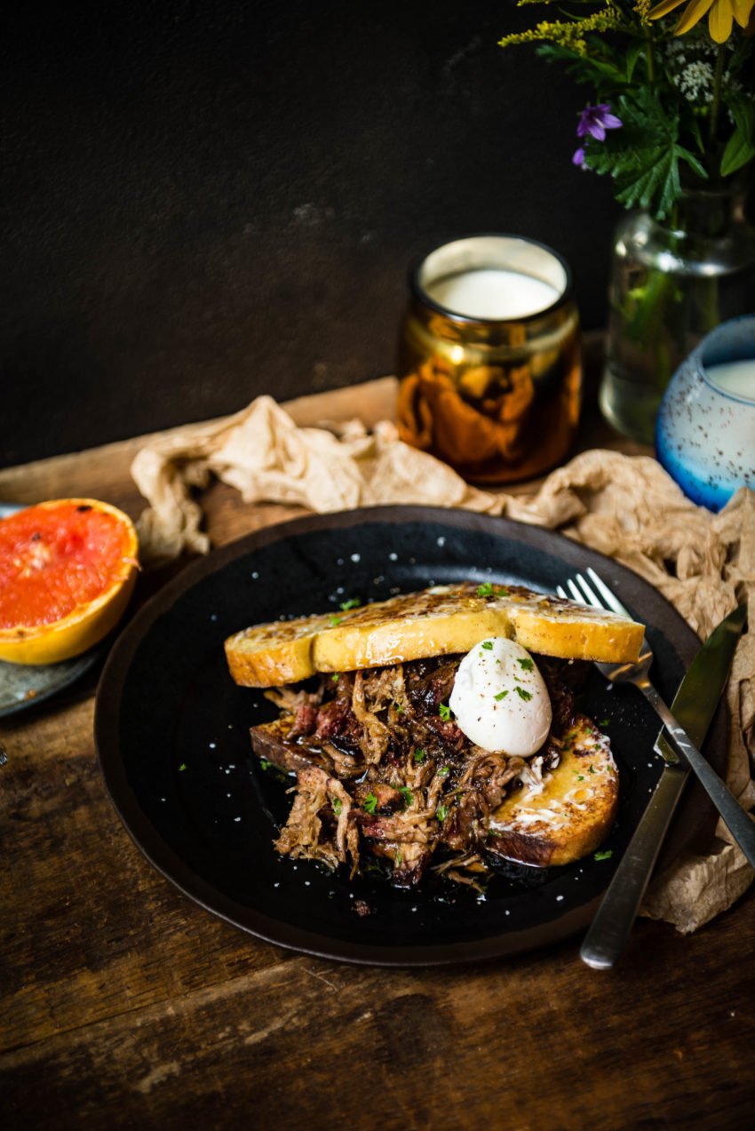 Two hearty slices of french toast, a pile of pulled pork, and a soft boiled egg, all topped in pure maple syrup. This is one breakfast you can't pass up! 