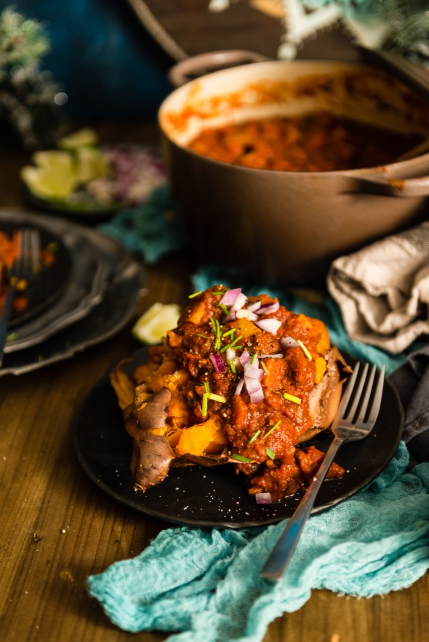 Call me crazy, but this turkey squash chili topping a split sweet potato is about the most filling and healthiest way you can get fat and happy.