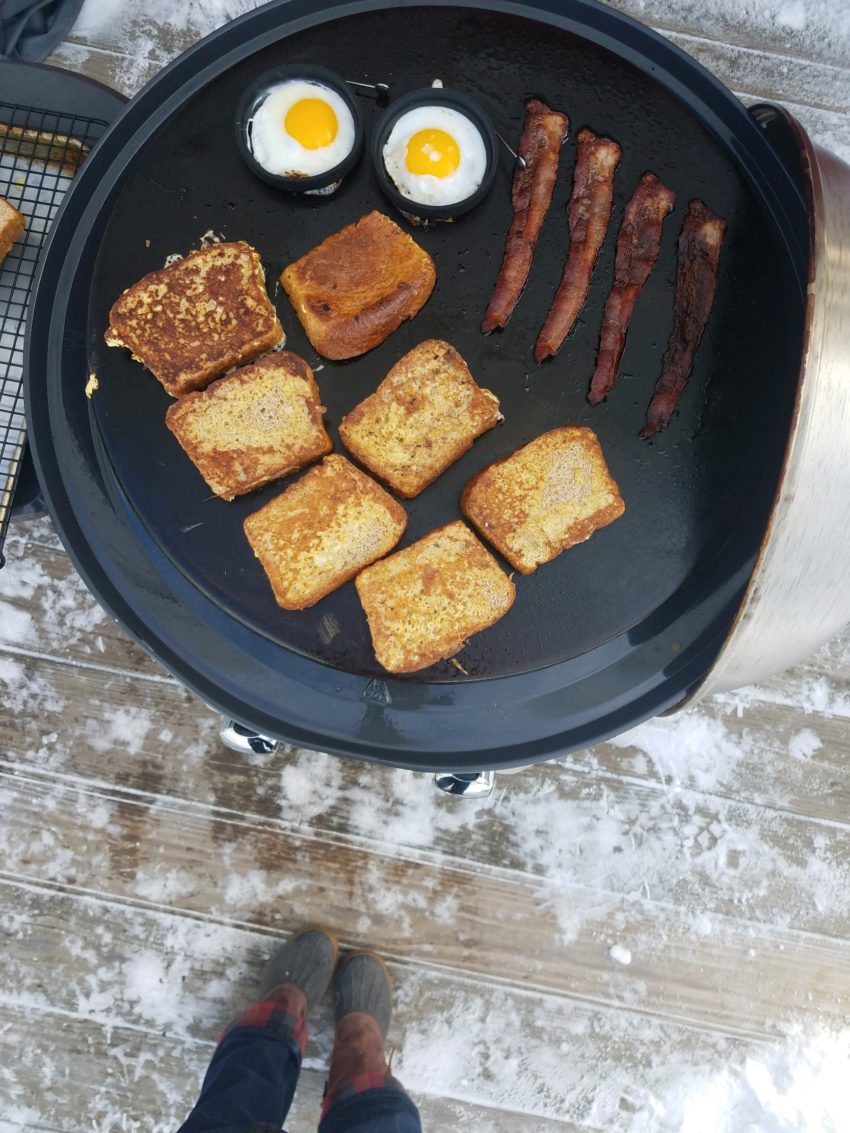 Cooking brunch on an outdoor griddle. 