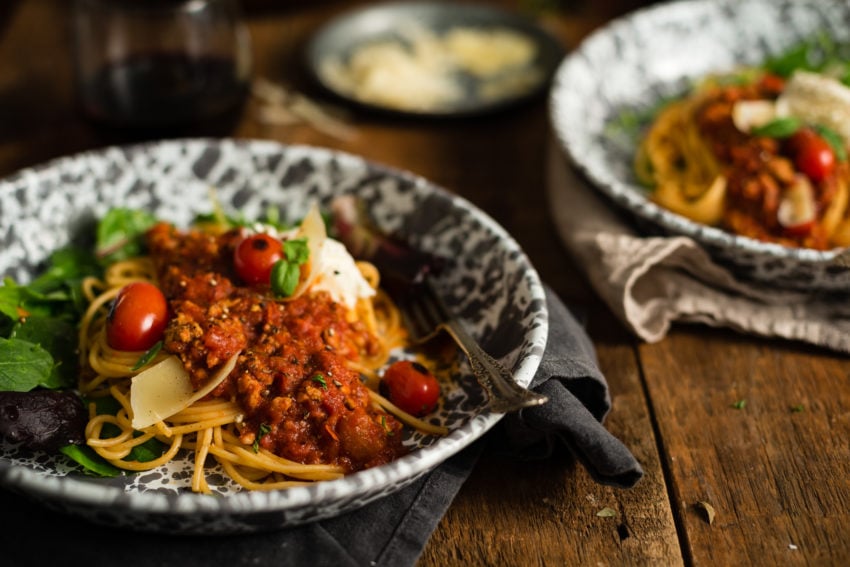 Meat sauce over pasta with a light salad in Crow Canyon serving dishes