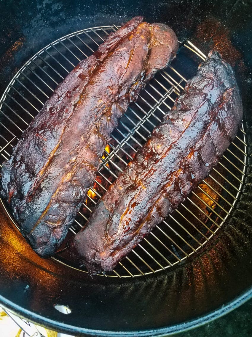 Smoking ribs over charcoal fire