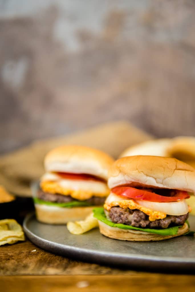 Homemade pimento cheese atop a grilled pork patty recipe is a fun and simple burger every single time! 