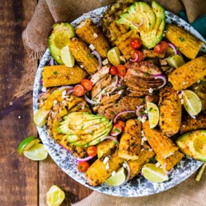 smoked chicken breast with grilled corn, avocado and pineapple platter
