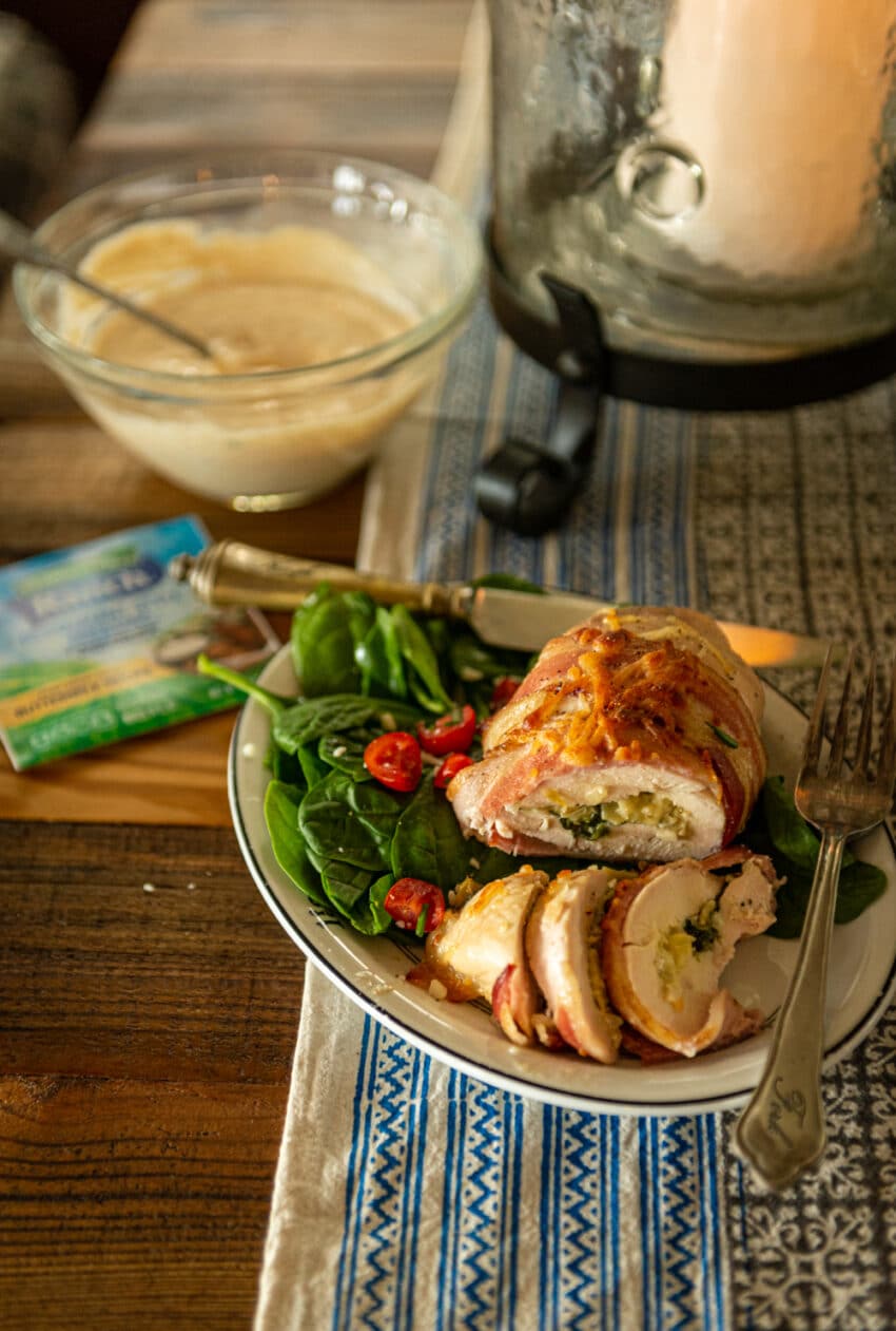 close up shot of sliced bacon wrapped stuffed chicken 