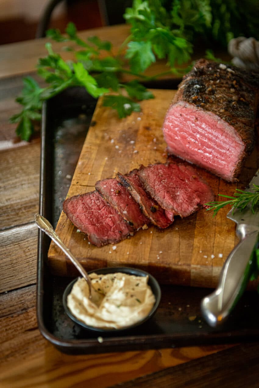 medium-rare slices of smoked roast with horseradish cream sauce